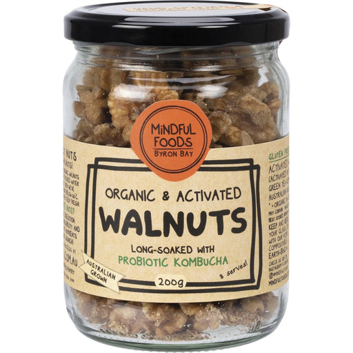Jar of organic and activated walnuts with a label on a white background