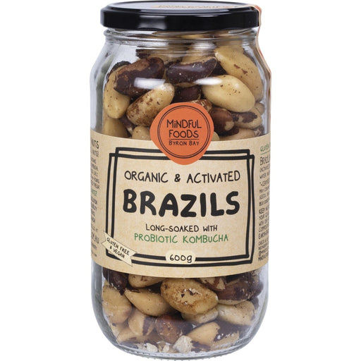 Jar of organic and activated brazils with a label on a white background